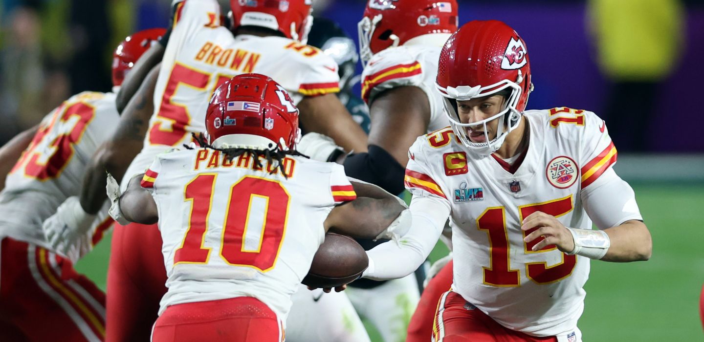 Kansas City Chiefs quarterback Patrick Mahomes (15) hands off to running back Isiah Pacheco (10) in the fourth quarter against the Philadelphia Eagles of Super Bowl LVII at State Farm Stadium.