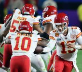 Kansas City Chiefs quarterback Patrick Mahomes (15) hands off to running back Isiah Pacheco (10) in the fourth quarter against the Philadelphia Eagles of Super Bowl LVII at State Farm Stadium.