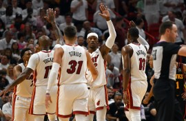 Apr 17, 2022; Miami, Florida, USA; Miami Heat forward Jimmy Butler (22) and teammates celebrate during a timeout by the Atlanta Hawks during the second half of game one of the first round for the 2022 NBA playoffs at FTX Arena. Mandatory Credit: Jim Rassol-USA TODAY Sports