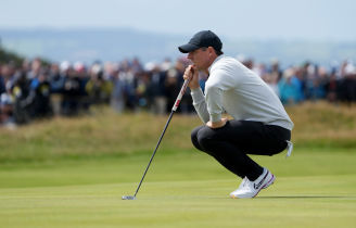 Rory McIlroy lines up a putt on the seventh hole during the second round of The Open Championship golf tournament at Royal Liverpool.