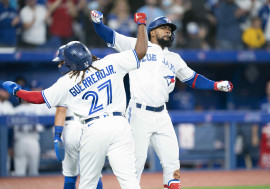 Toronto Blue Jays right fielder Teoscar Hernandez (37) celebrates with first baseman Vladimir Guerrero Jr. (27) after hitting a three run home run during the fifth inning against the Texas Rangers at Rogers Centre . Mandatory Credit: Nick Turchiaro-USA TODAY Sports.