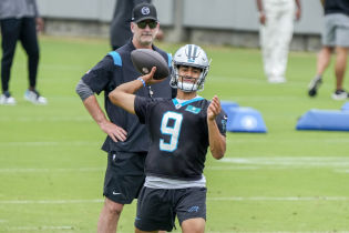 Carolina Panthers head coach Frank Reich watches quarterback Bryce Young (9) during the Carolina Panthers minicamp.