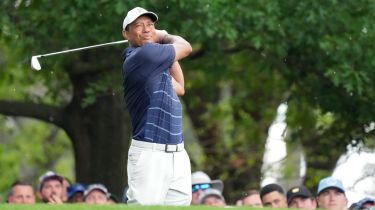 Tiger Woods plays his shot from the fourth tee during the second round of The Masters golf tournament.
