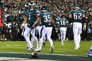 Philadelphia Eagles running back Boston Scott (35) celebrates his touchdown with quarterback Jalen Hurts (1) during the second quarter against the New York Giants during an NFC divisional round game at Lincoln Financial Field.