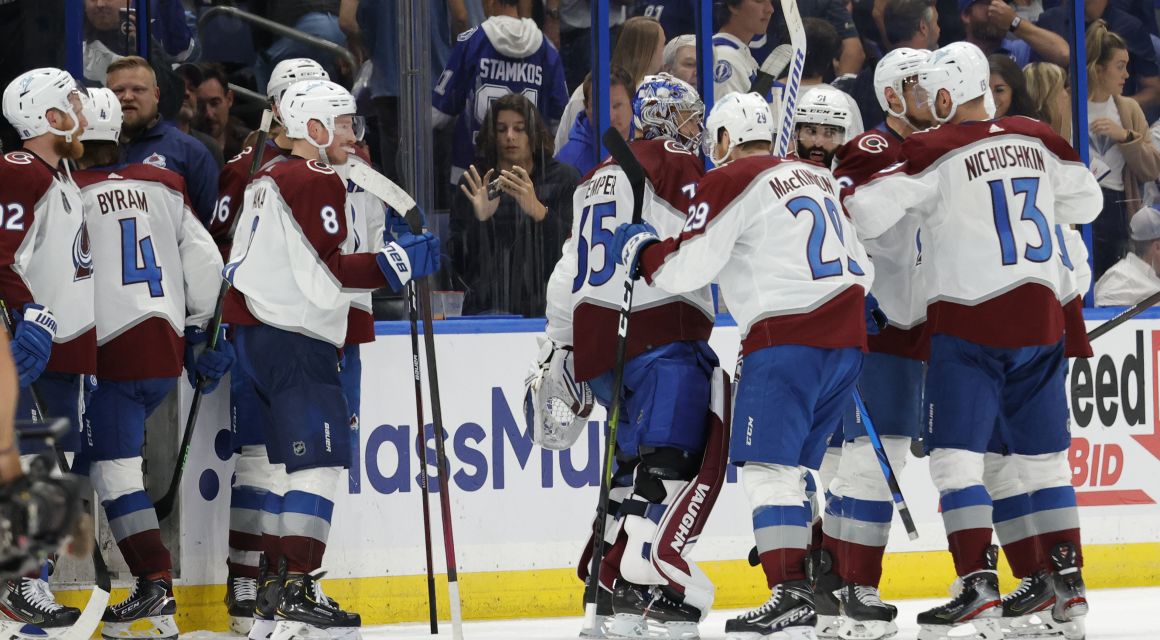Colorado Avalanche players celebrate while leaving the ice after their game against the Tampa Bay Lightning in game four of the 2022 Stanley Cup Final at Amalie Arena. Mandatory Credit: Geoff Burke-USA TODAY Sports.