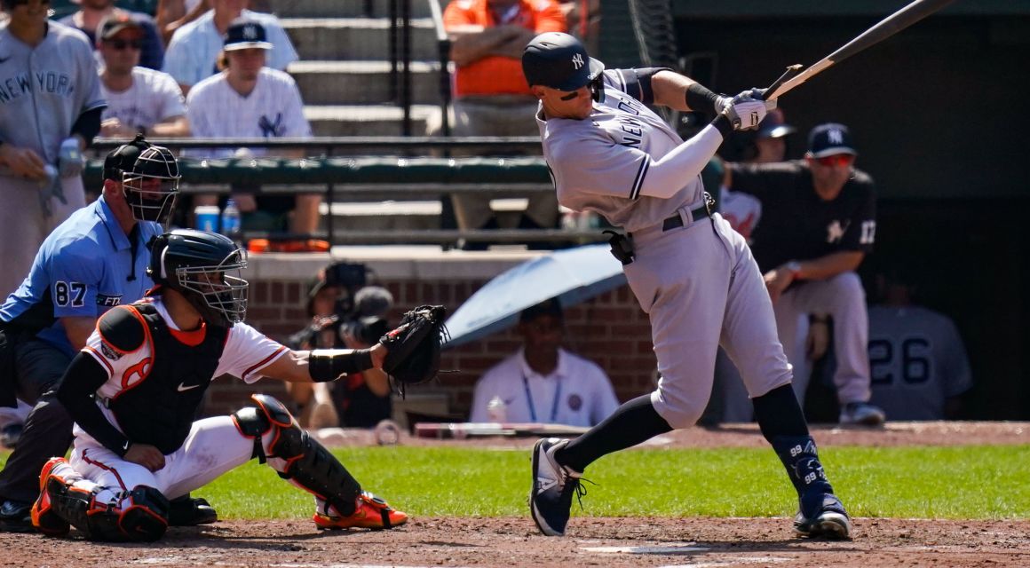 New York Yankees center fielder Aaron Judge (99) hits a broken bat single during the sixth inning against the Baltimore Orioles at Oriole Park at Camden Yards. Mandatory Credit: Tommy Gilligan-USA TODAY Sports.