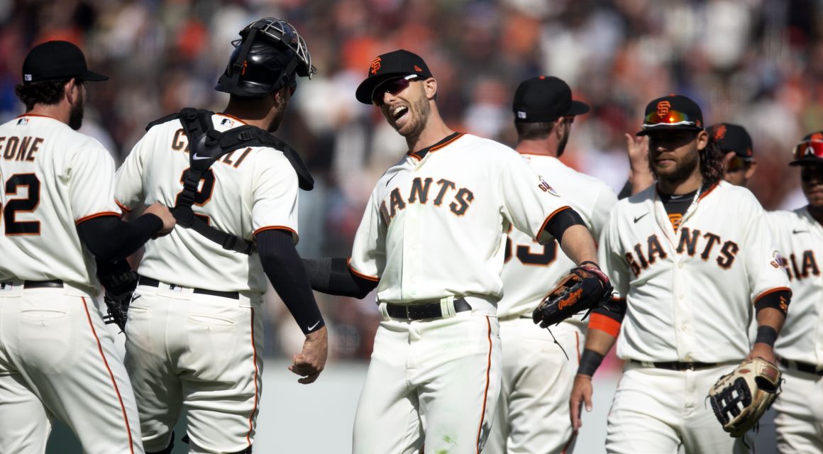 San Francisco Giants players celebrate their 3-2 victory over the Miami Marlins at Oracle Park. Mandatory Credit: D. Ross Cameron-USA TODAY Sports.