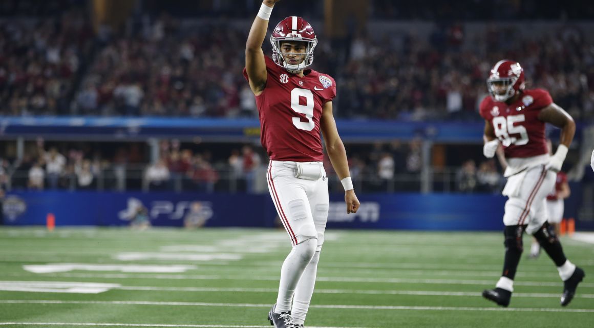 Alabama Crimson Tide quarterback Bryce Young (9) reacts after throwing a touchdown in the fourth quarter against the Cincinnati Bearcats during the 2021 Cotton Bowl college football CFP national semifinal game at AT&T Stadium. Mandatory Credit: Tim Heitman-USA TODAY Sports.