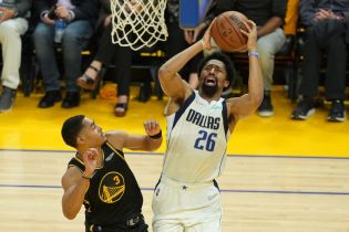 May 18, 2022; San Francisco, California, USA; Dallas Mavericks guard Spencer Dinwiddie (26) scores after being fouled by Golden State Warriors guard Jordan Poole (3) in the third quarter of game one of the 2022 western conference finals at Chase Center. Mandatory Credit: Darren Yamashita-USA TODAY Sports