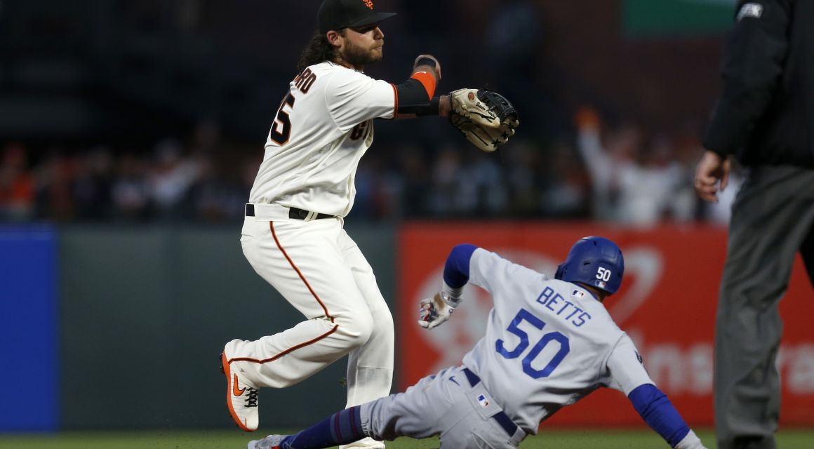 Oct 8, 2021; San Francisco, CA; Los Angeles Dodgers RF Mookie Betts (50) is out as San Francisco Giants SS Brandon Crawford (35) turns a double play. / © D. Ross Cameron-USA TODAY Sports