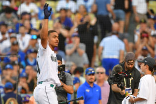 Seattle Mariners center fielder Julio Rodriguez (44) reacts after hitting in the final round during the 2022 Home Run Derby at Dodgers Stadium. Mandatory Credit: Gary Vasquez-USA TODAY Sports.