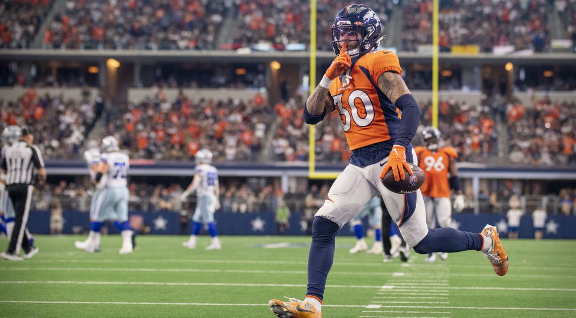 Nov 7, 2021; Arlington, TX; Denver Broncos safety Caden Sterns (30) motions to the Dallas Cowboys fans after he intercepts a pass in the second half.  / © Jerome Miron-USA TODAY Sports