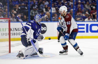 Tampa Bay Lightning goaltender Andrei Vasilevskiy (88) makes a save against Colorado Avalanche left wing Gabriel Landeskog (92) during the third period in game three of the 2022 Stanley Cup Final at Amalie Arena. Mandatory Credit: Geoff Burke-USA TODAY Sports.