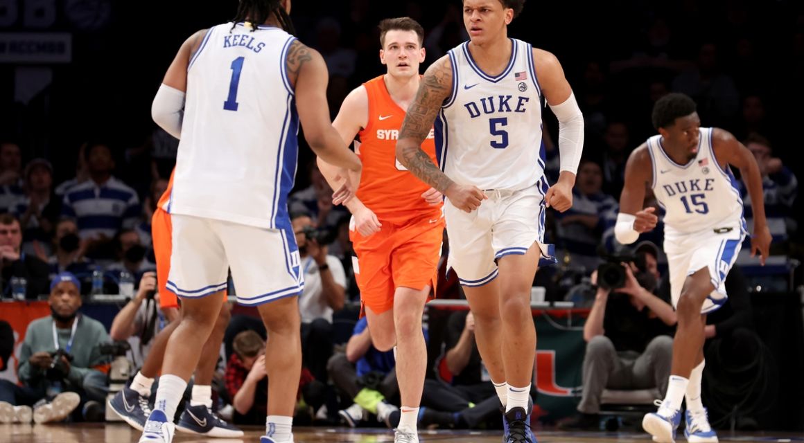 Mar 10, 2022; Brooklyn, NY, USA; Duke Blue Devils forward Paolo Banchero (5) celebrates with guard Trevor Keels (1) in front of Syracuse Orange forward Jimmy Boeheim (0) during the second half at Barclays Center. Mandatory Credit: Brad Penner-USA TODAY Sports