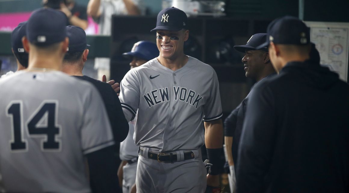 Yankees right fielder Aaron Judge (99) walks in the dugout after being taken out in the second inning against the Texas Rangers