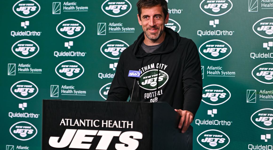 New York Jets quarterback Aaron Rodgers (8) speaks at a press conference after practice at Atlantic Health Jets Training Center.