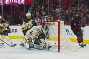 Carolina Hurricanes center Vincent Trocheck (16) scores a goal against Boston Bruins goaltender Linus Ullmark (35) during the third period in game one of the first round of the 2022 Stanley Cup Playoffs at PNC Arena. Mandatory Credit: James Guillory-USA TODAY Sports.