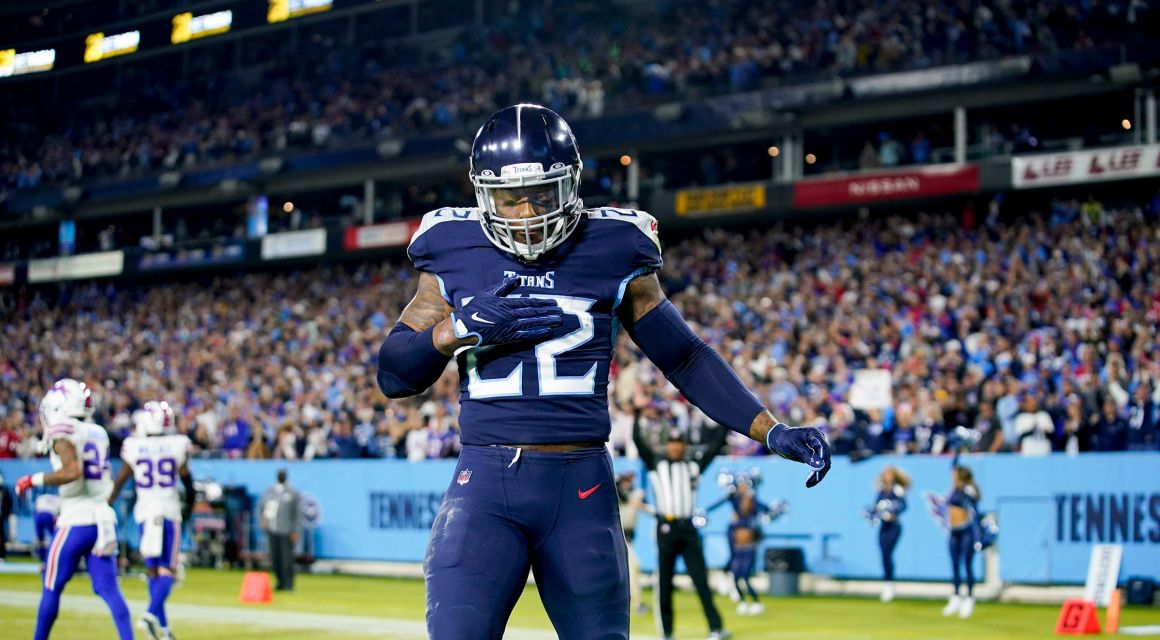 Titans running back Derrick Henry (22) celebrates his 76-yard touch down against the Bills at Nissan Stadium. / 