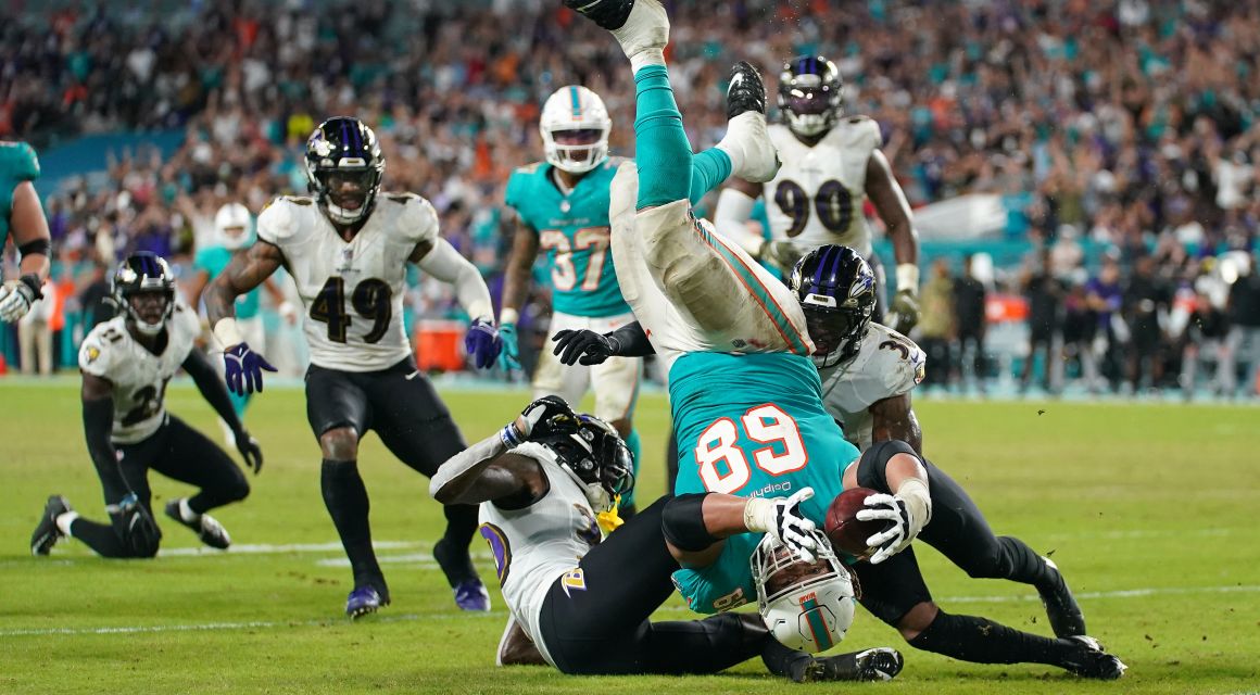 Nov 11, 2021; Miami Gardens, FL; Miami Dolphins guard Robert Hunt (68) is upended while reaching for the end zone against the Baltimore Ravens.  / © Jasen Vinlove-USA TODAY Sports