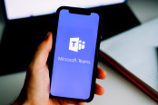 hand holding iPhone with Microsoft Teams