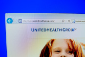A computer screen shows details of UnitedHealth Group main page