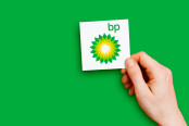 Hand holding a BP logo