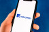 hand holds smartphone with qualcomm logo