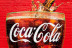A glass full of Coca Cola