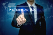 Businessman hand touching PREFERRED STOCK button