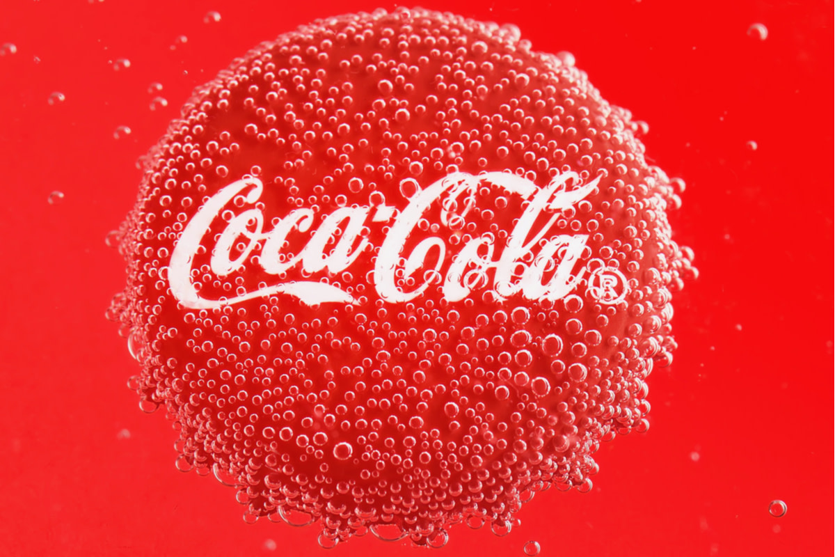 Coca Cola Cap in bubbles on a red background