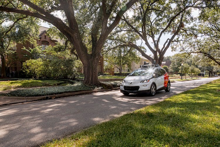 Cruise vehicle driving in Houston residential neighborhood cover