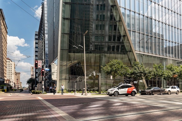 Cruise vehicle driving in downtown Houston at stoplight