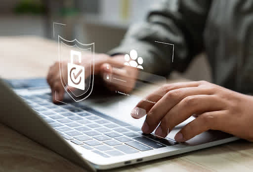 A person typing on a laptop secured with a shield, illustrating how to protect Fastvue Reporter. A person typing on a laptop secured with a shield, illustrating how to protect Fastvue Reporter.