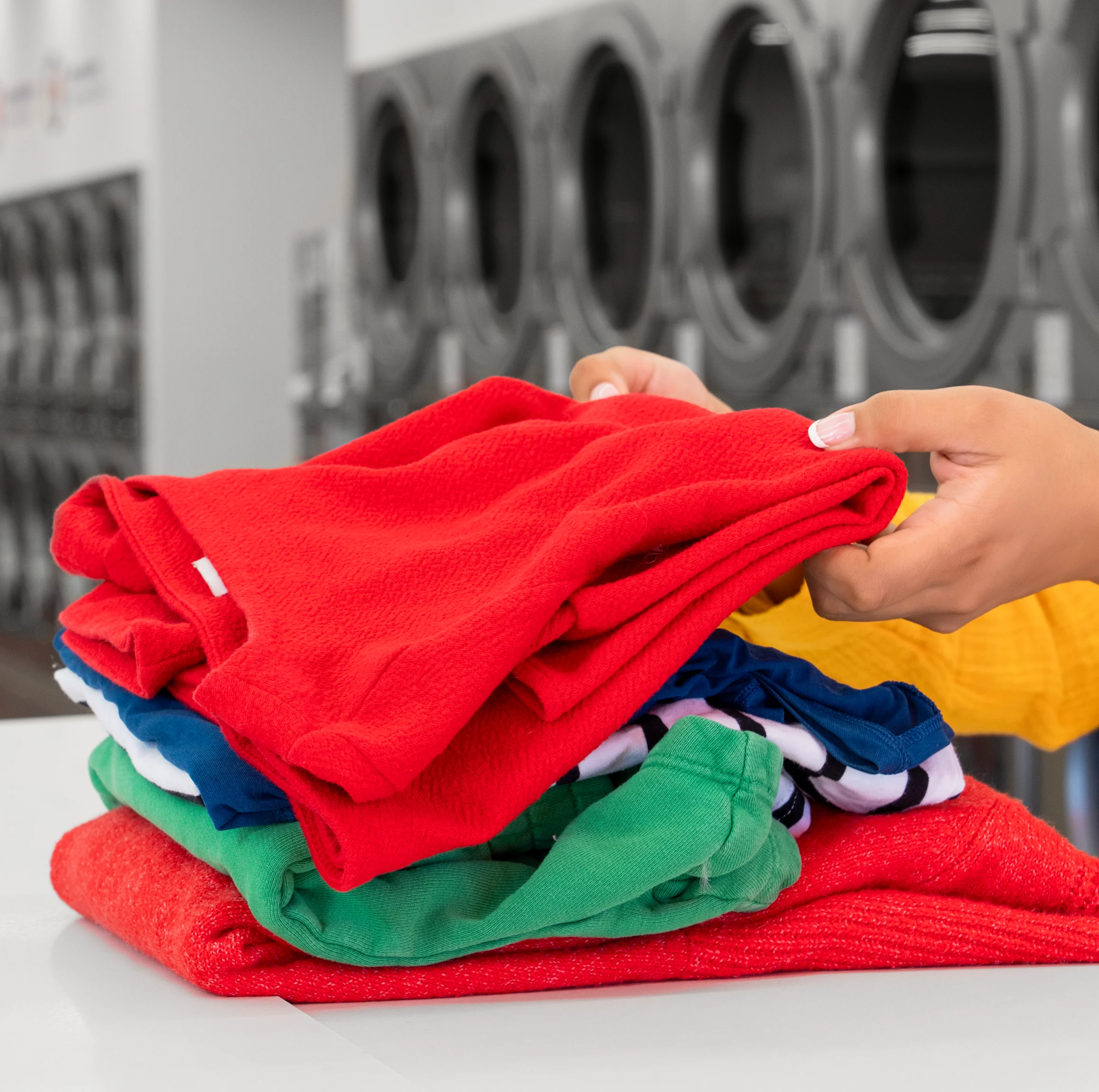 Folding clothes for wash and fold services