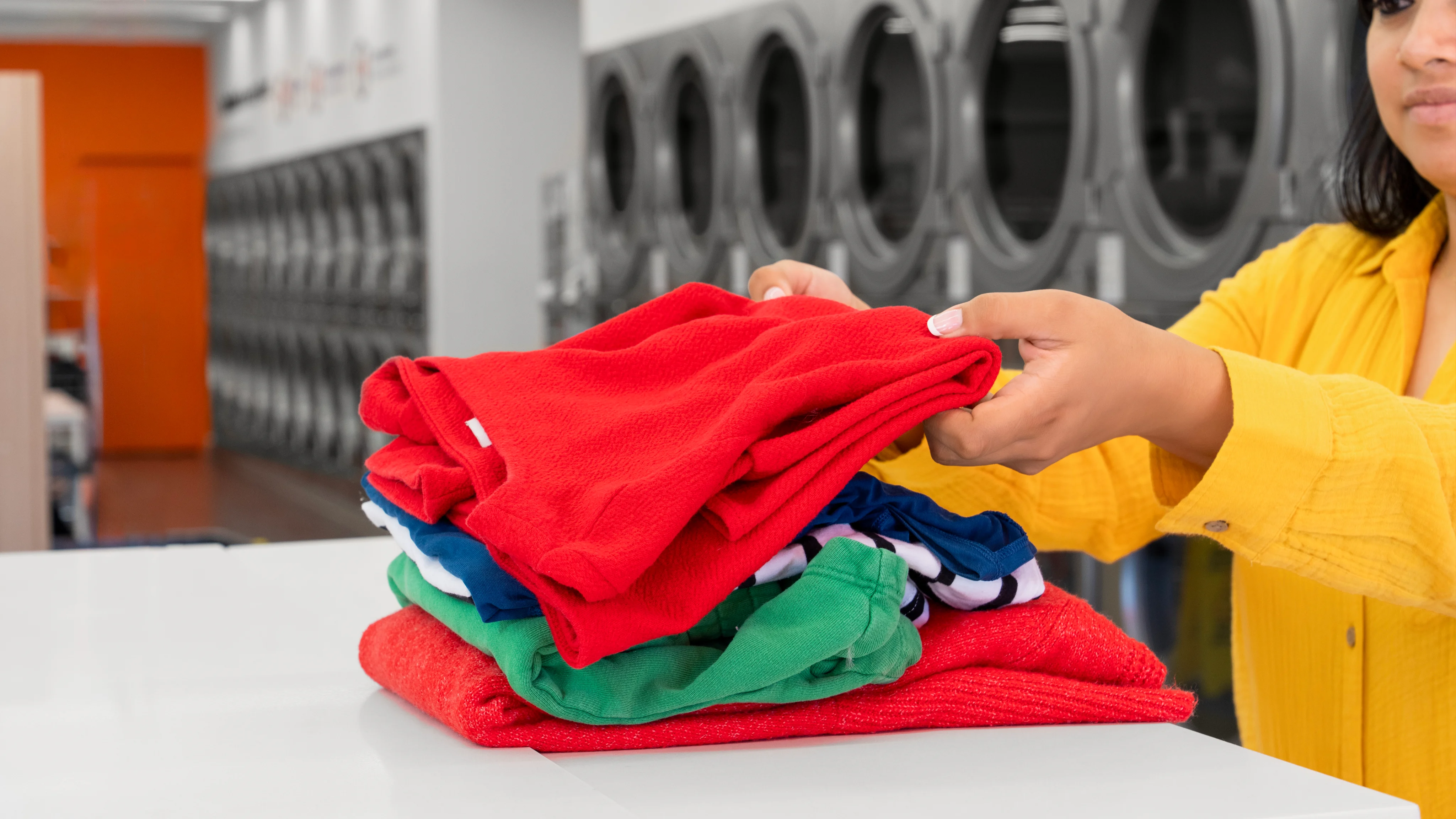 Folding clothes for wash and fold services
