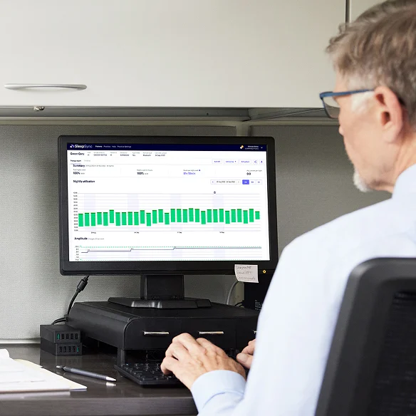 Doctor looking at computer screen
