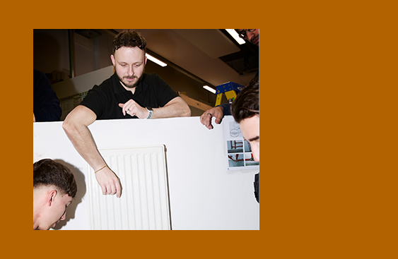 Teacher standing teaching students