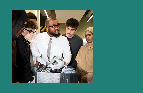 Teacher in classroom with student wearing virtual headset