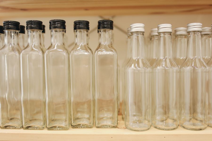 Rows of empty clear glass bottles for wholesale packaging