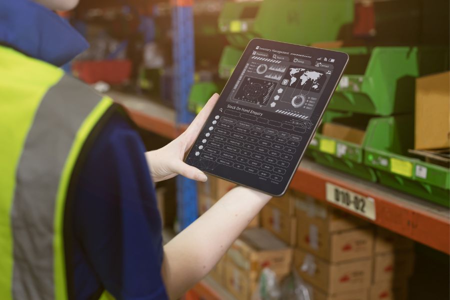 warehouse employee utilizing inventory management software