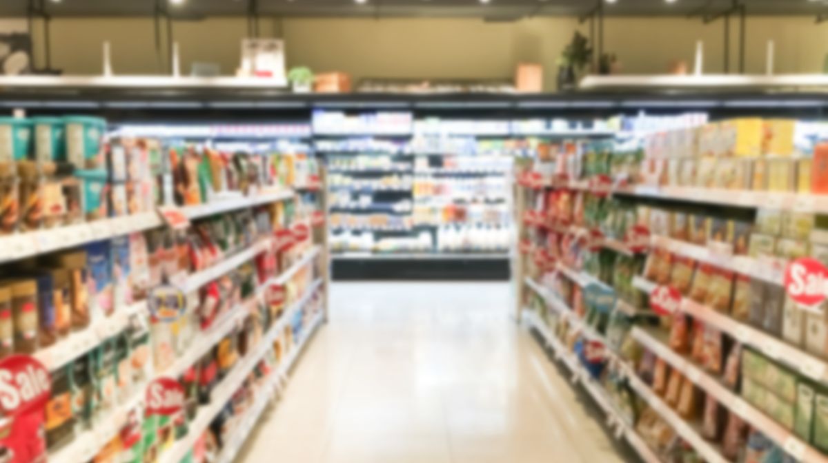 Grocery Store Aisle with Shelves Filled with Food Products