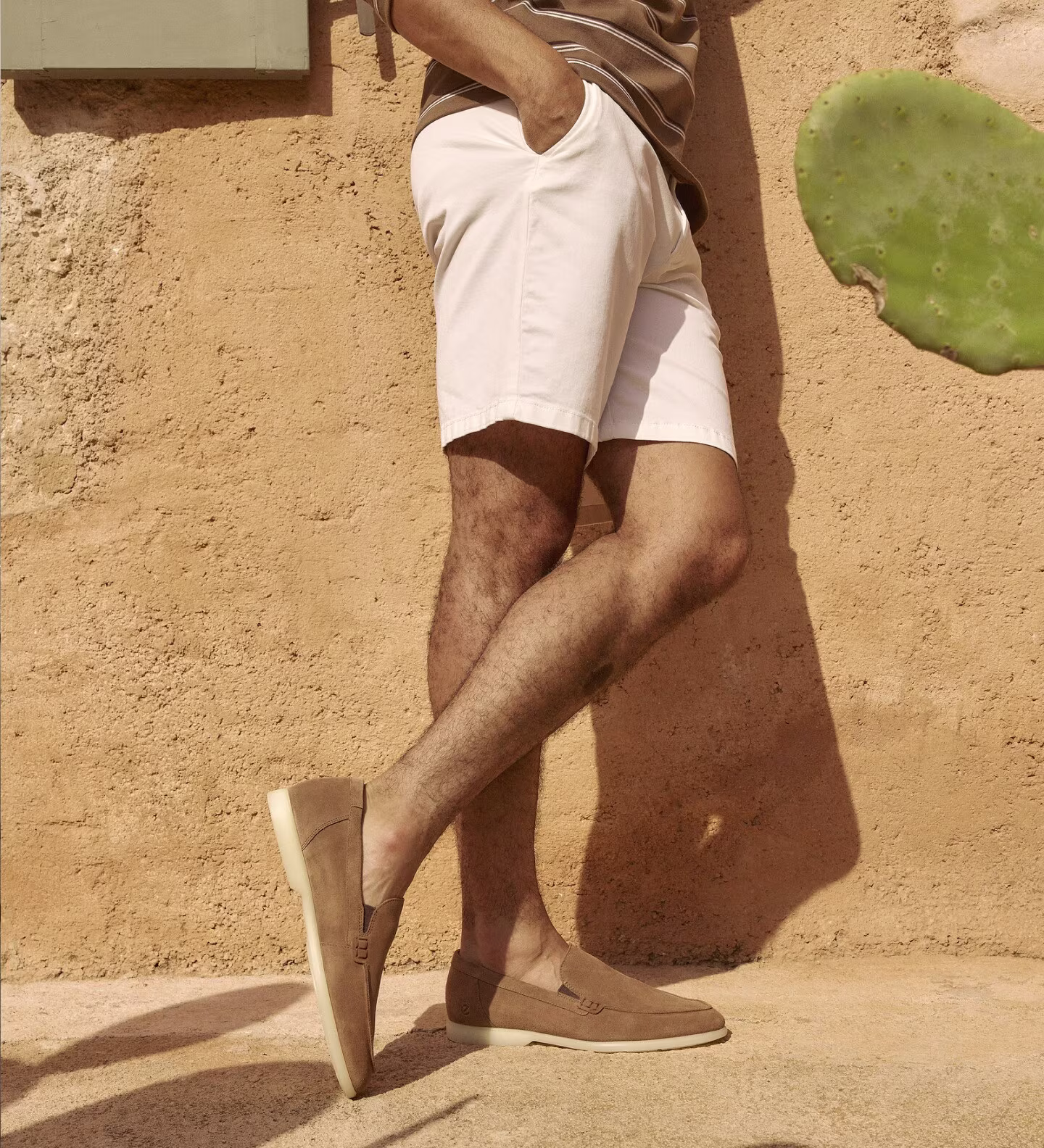 Discover summer style with Ecco men's slip-on shoes. Beige suede loafers perfectly match light shorts, creating a casual, holiday look. Experience everyday comfort and premium quality that Ecco is known for. Perfect for warm days and relaxed weekends.