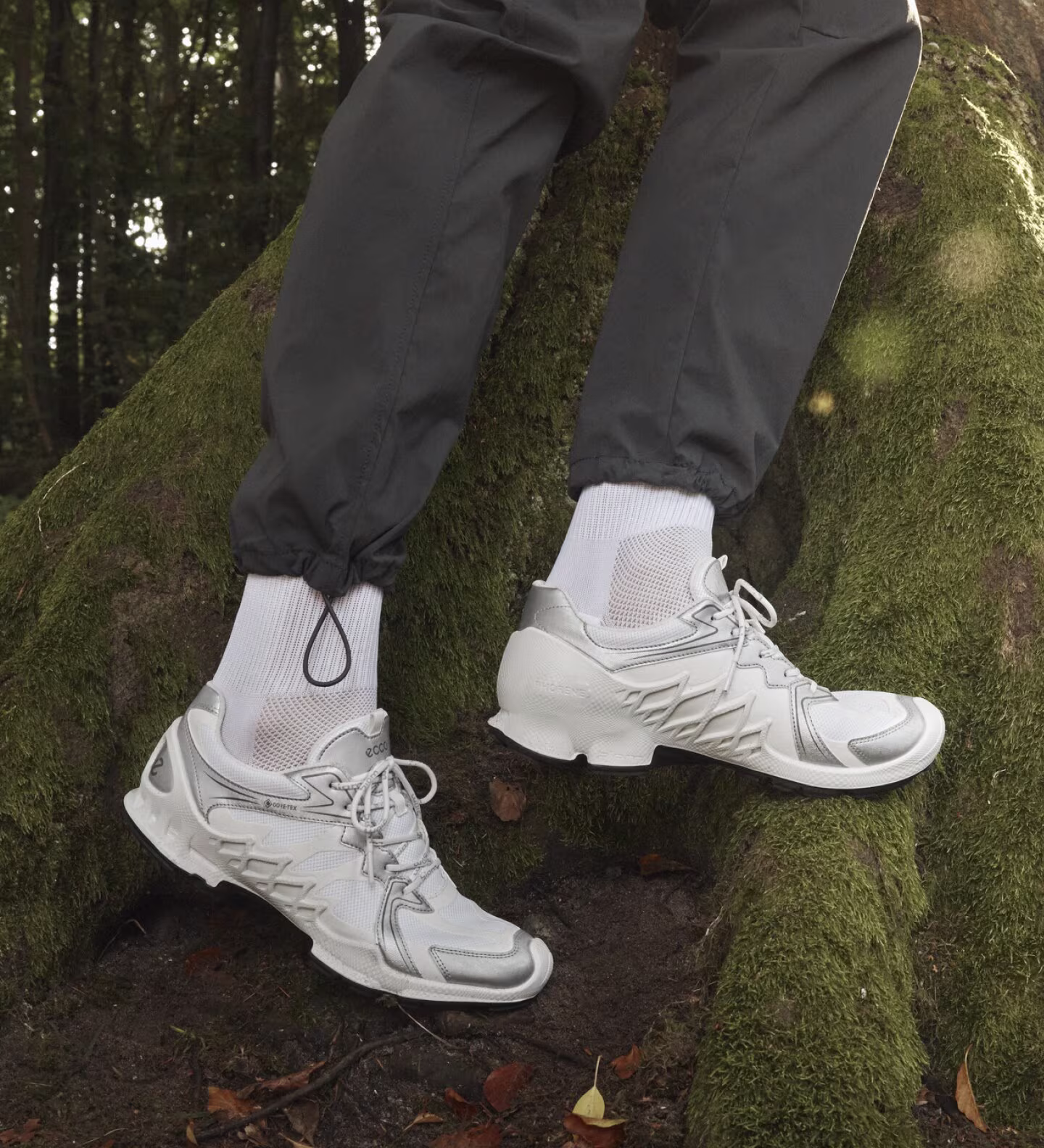 Embrace the outdoors with these all-white ECCO trail sneakers, featuring metallic silver accents and high-performance PHORENE midsoles for ultimate comfort and grip.
