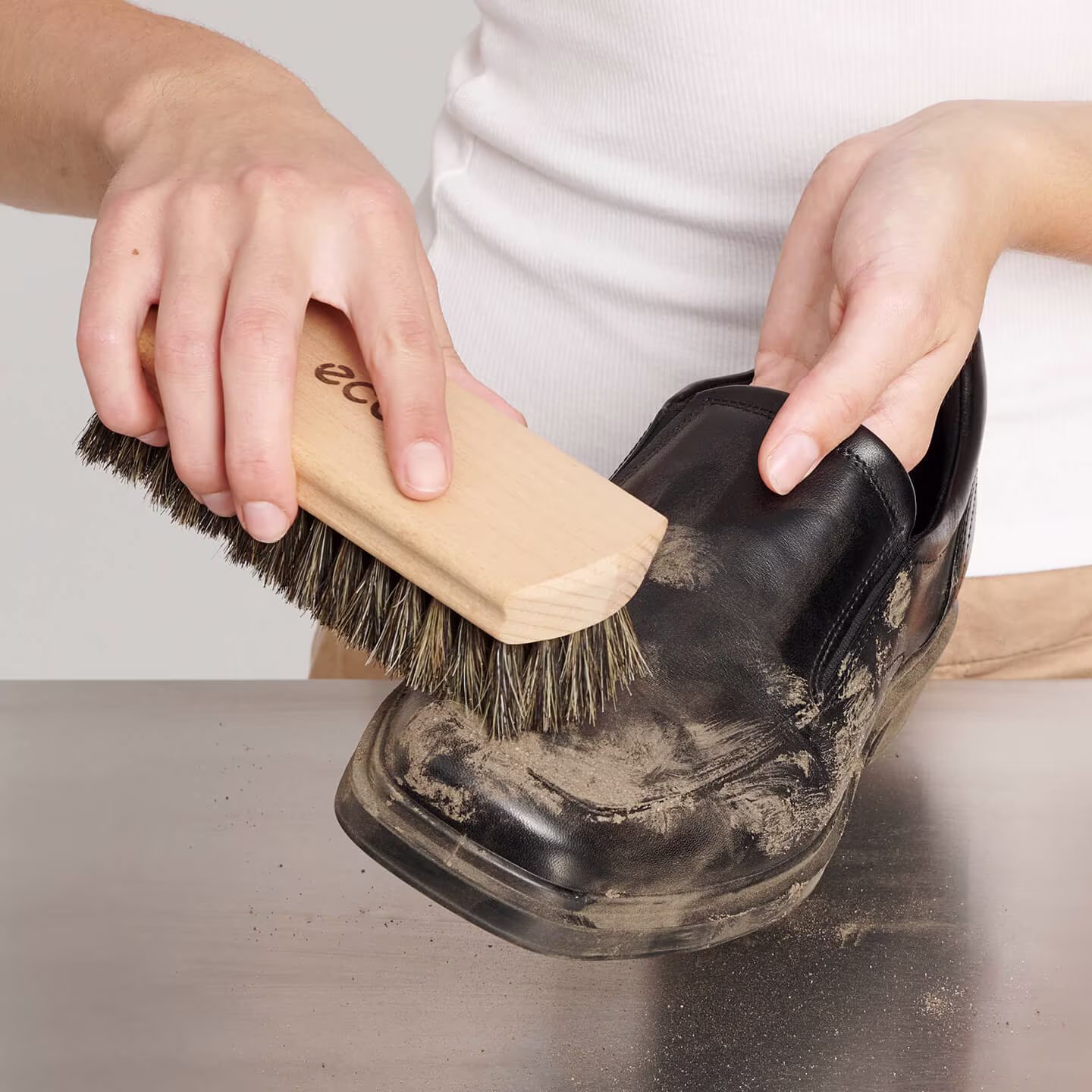 Take out any laces and brush the shoe lightly to remove dirt.