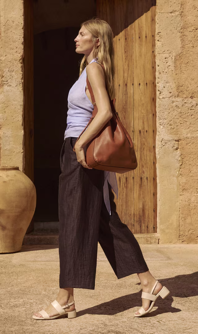 ECCO Liva Sandal 35 in cream leather with a low block heel, paired with cropped dark trousers and a tan shoulder bag.