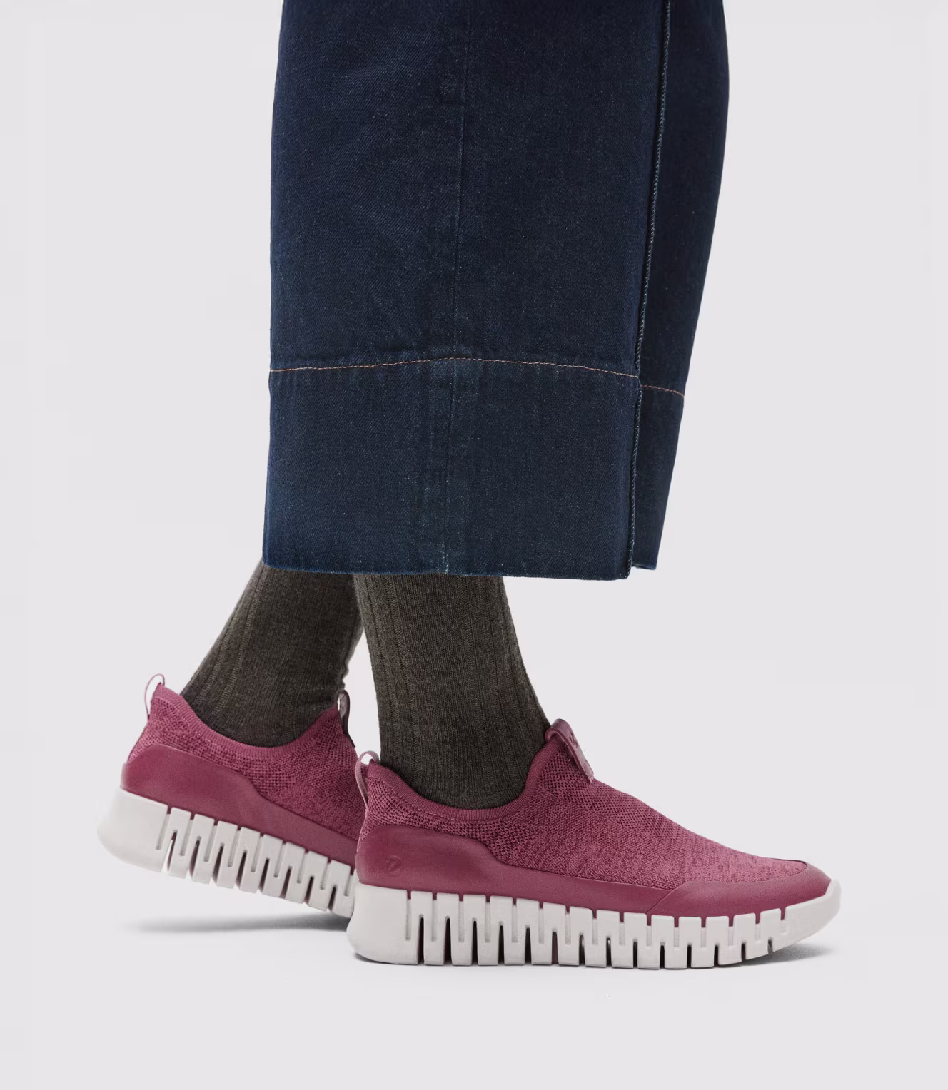 Step into effortless style with these pink ECCO slip-on sneakers. A deeply grooved, flexible sole offers superior shock absorption and lightweight comfort.