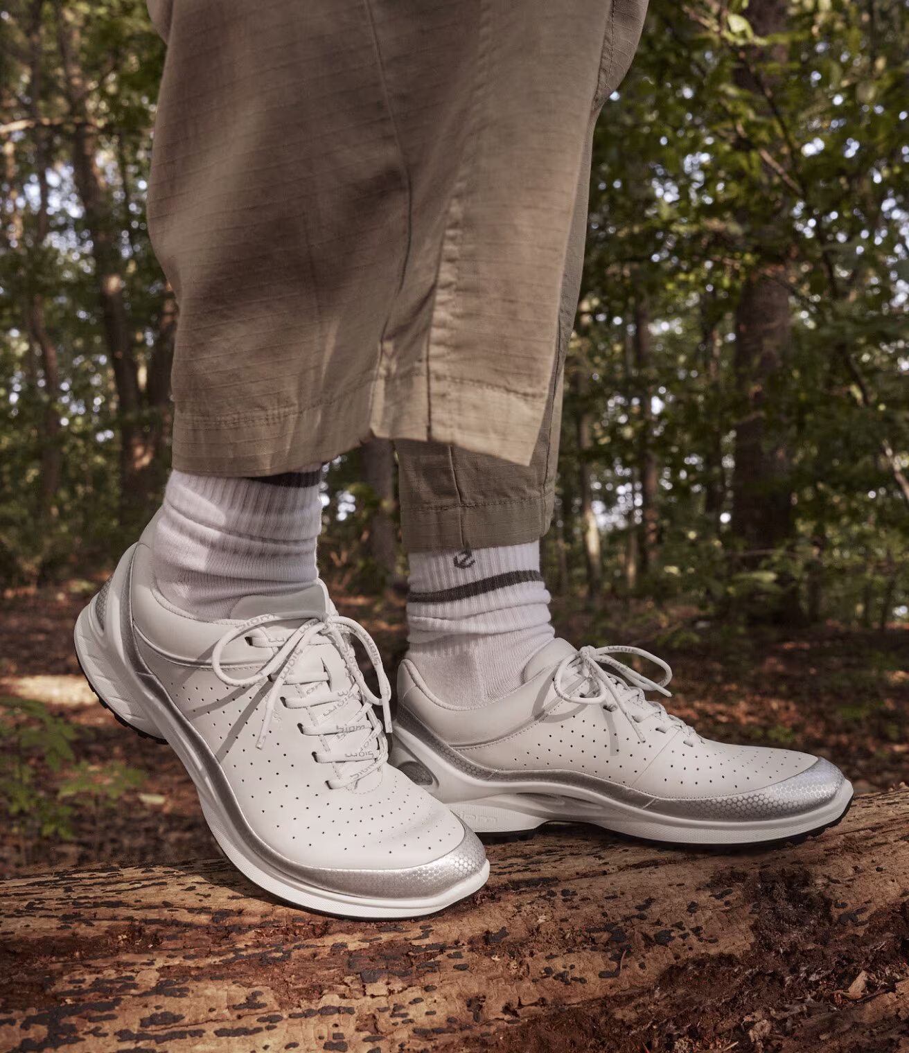 Experience natural motion with these premium white leather ECCO sneakers. Metallic accents and rugged soles blend modern aesthetics with trail-ready comfort.