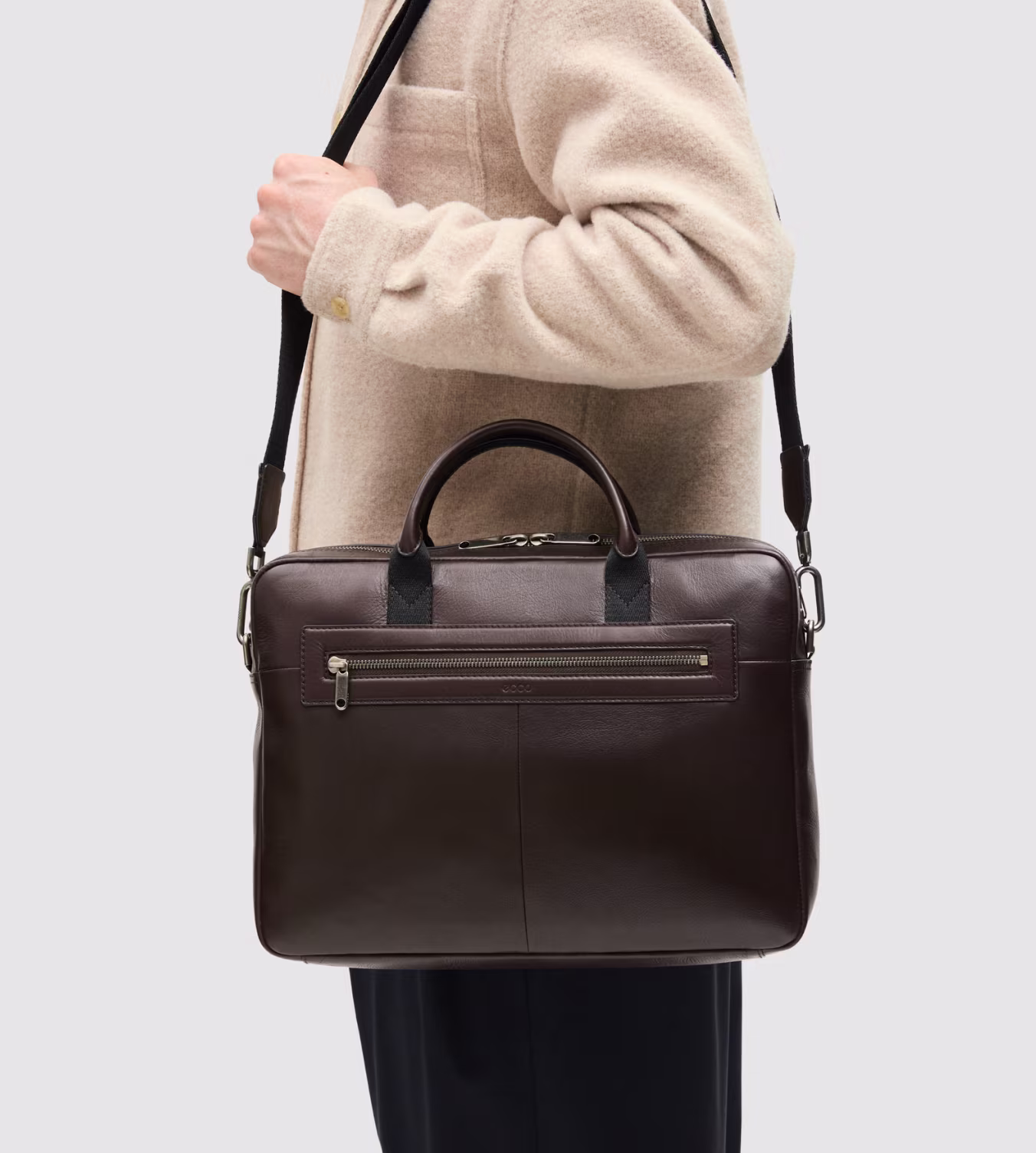 Meticulously crafted from premium dark brown leather, this sleek briefcase offers timeless Scandinavian design and refined storage for work essentials.
