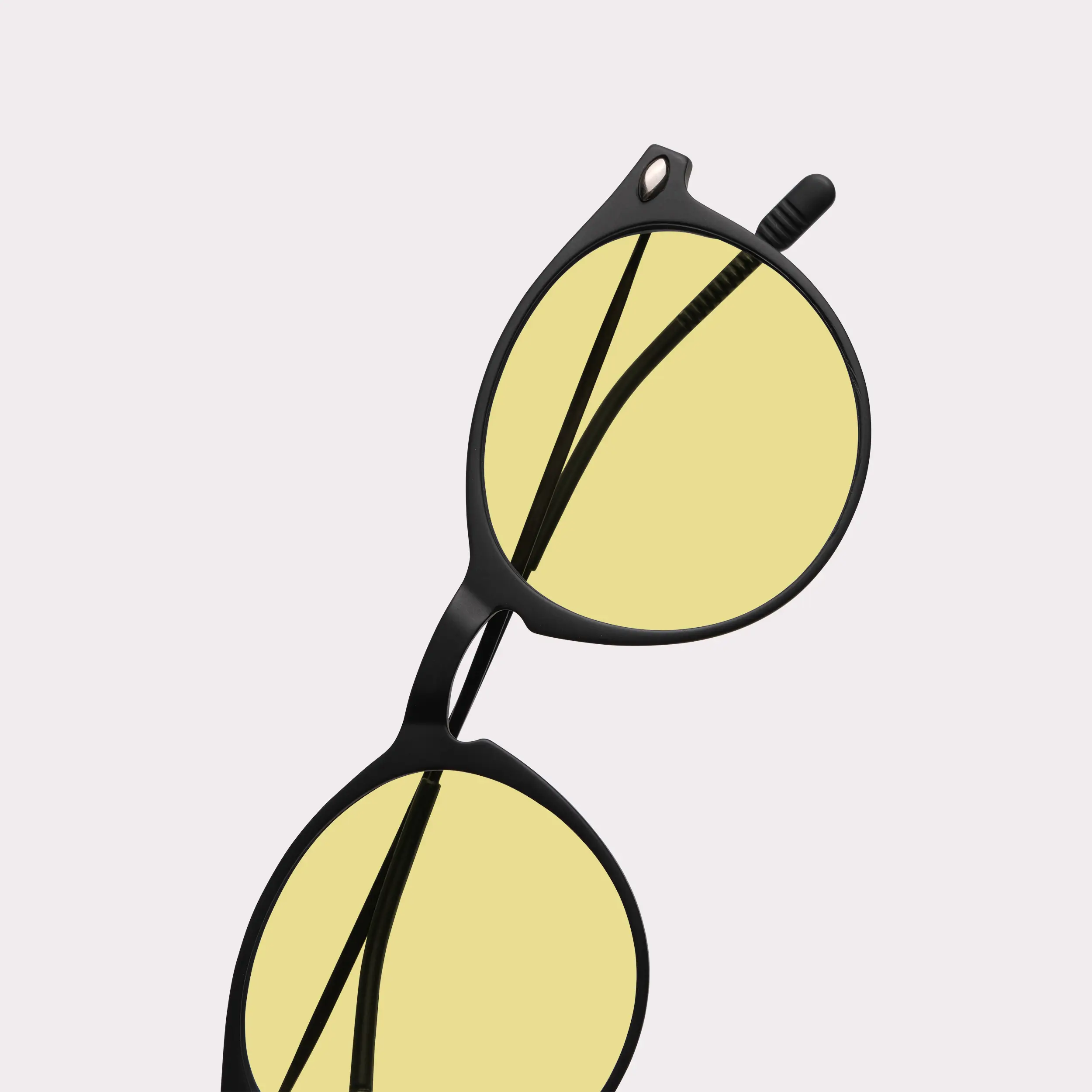 A pair of Cruz Black Driving Glasses in a macro view