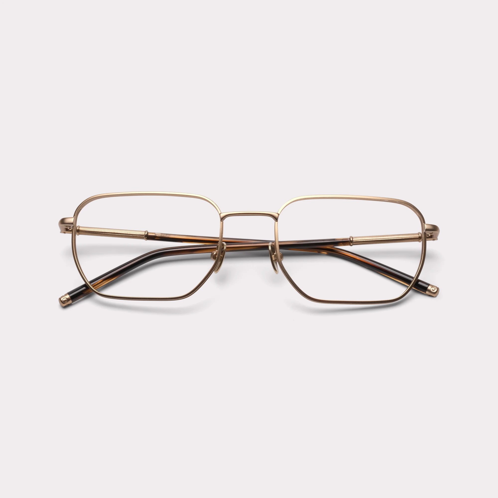 Une paire de Bram Light Gold Lunettes sur prescription repliée